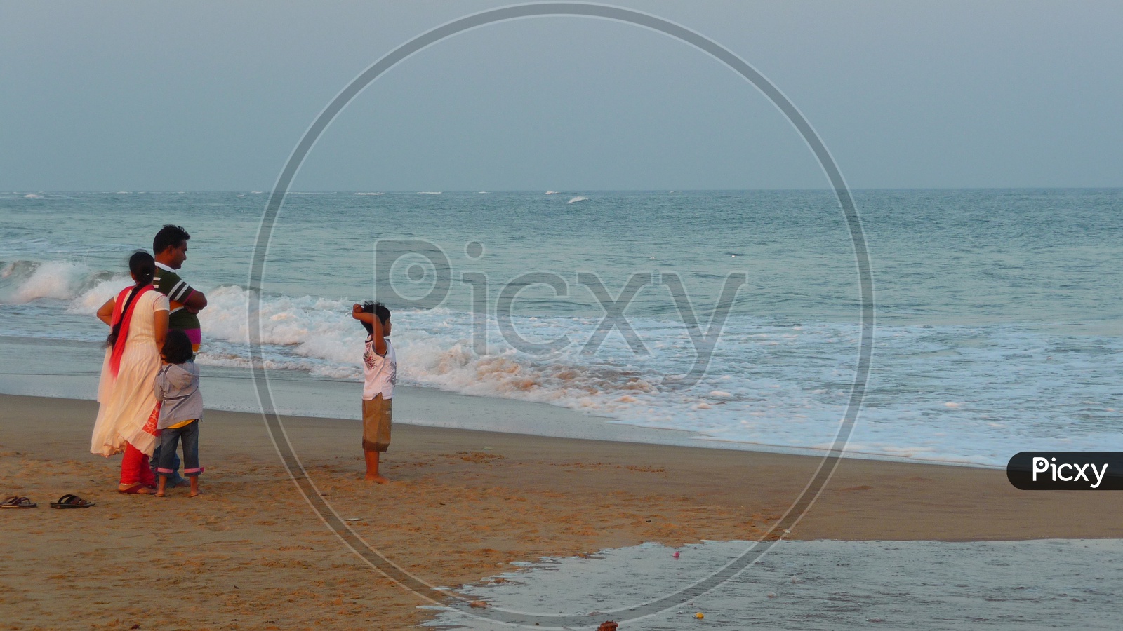 Family enjoying Waves on Shore, Bay of Bengal Sea