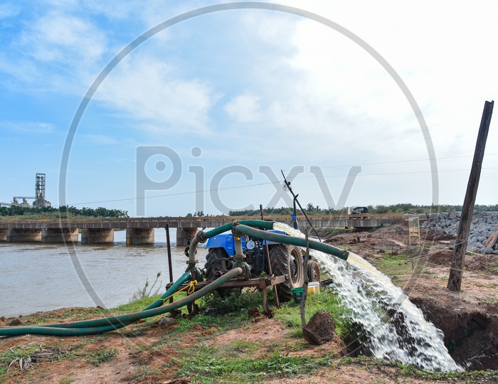 Godavari  water being pulled into farms by using Tractor Engines.