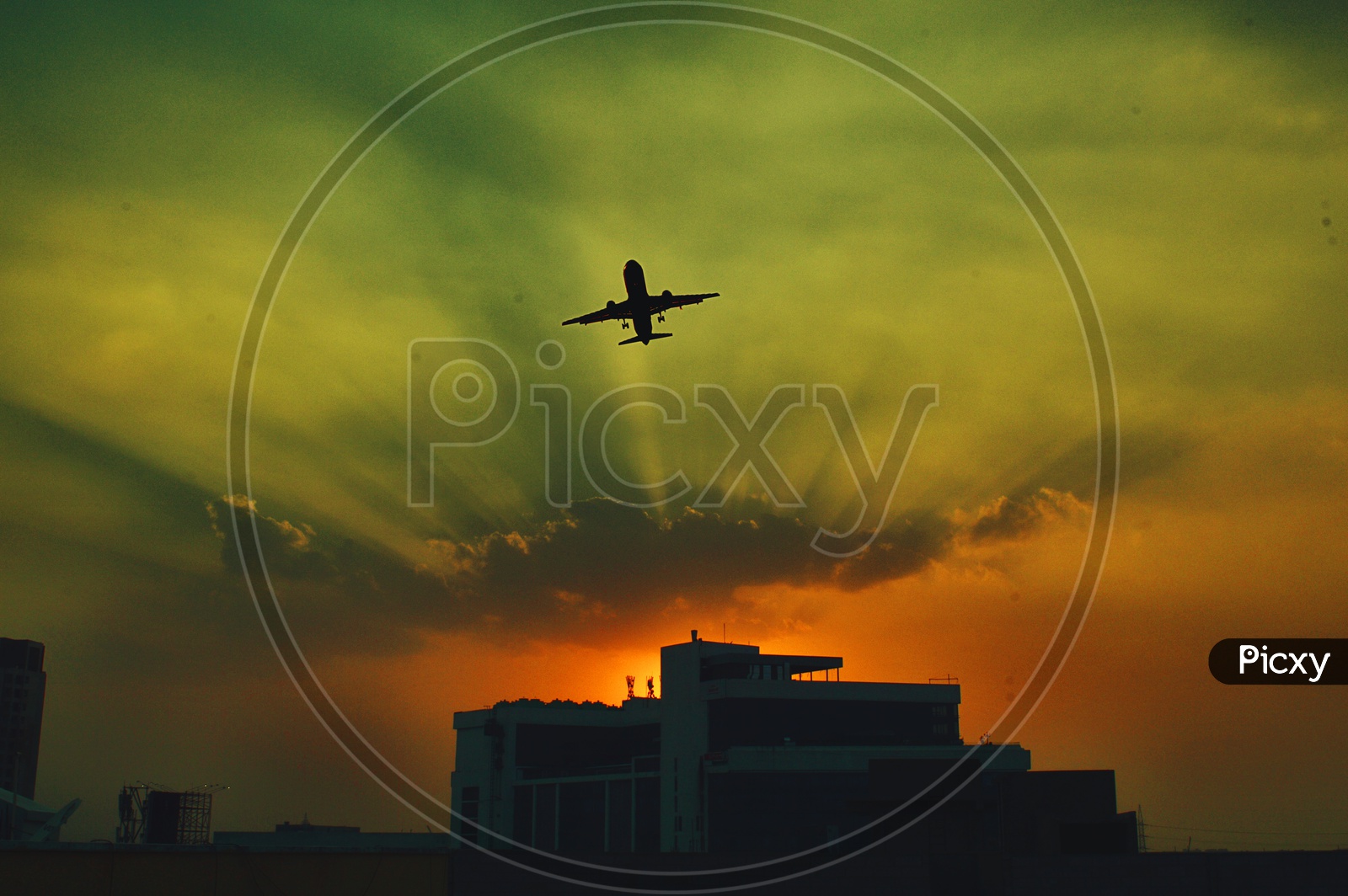 Silhouetted Aeroplane flying over the sky