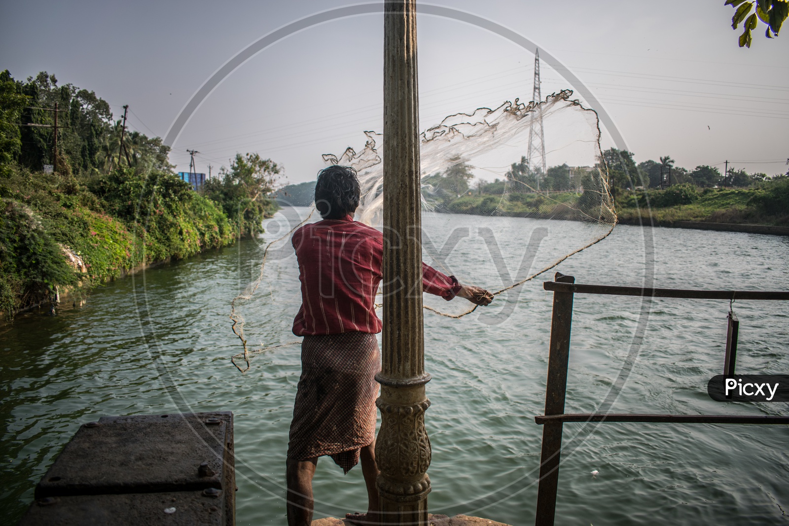 Fisherman casting his net