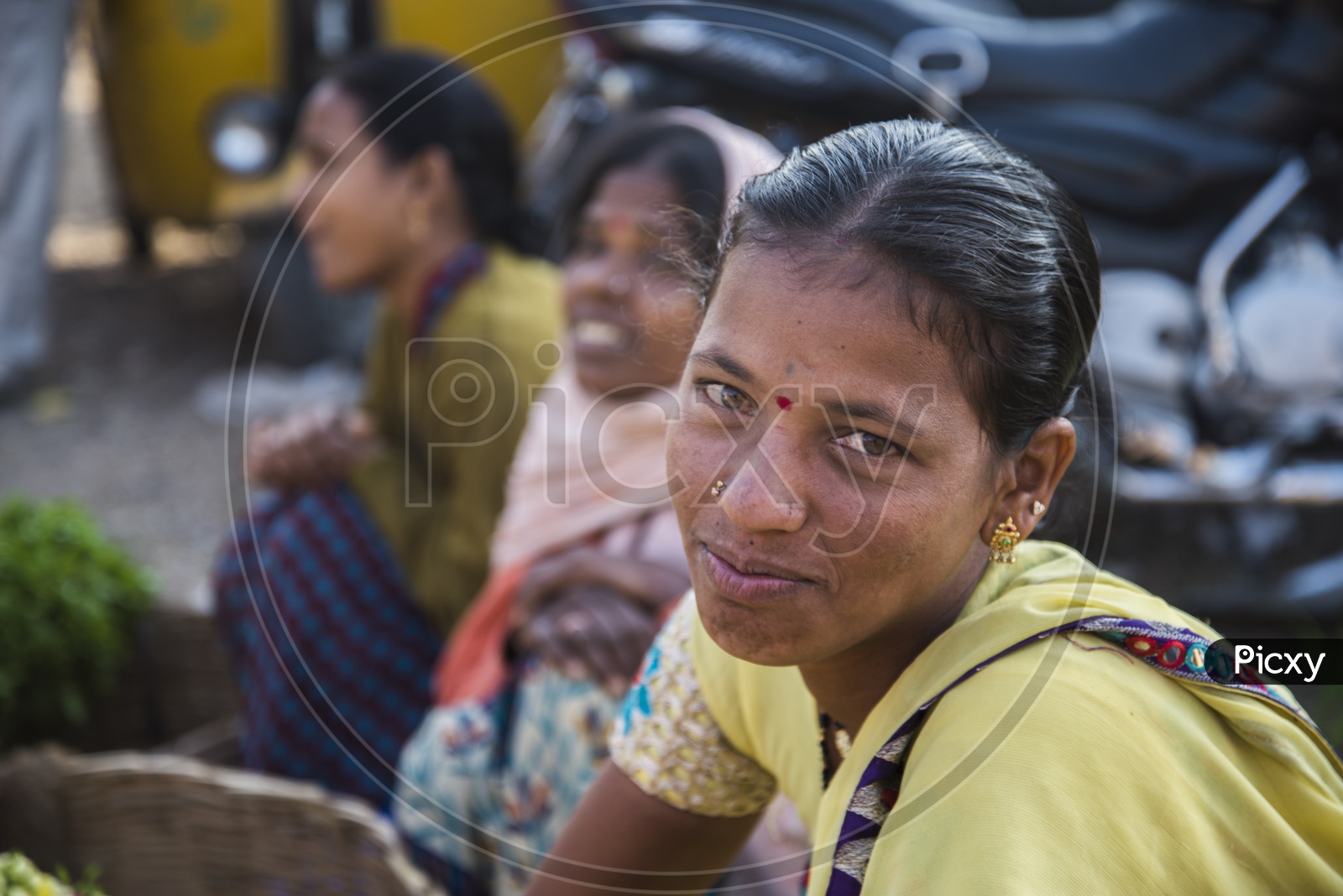 Happy female vendor at Gudimalkapur Flower Market