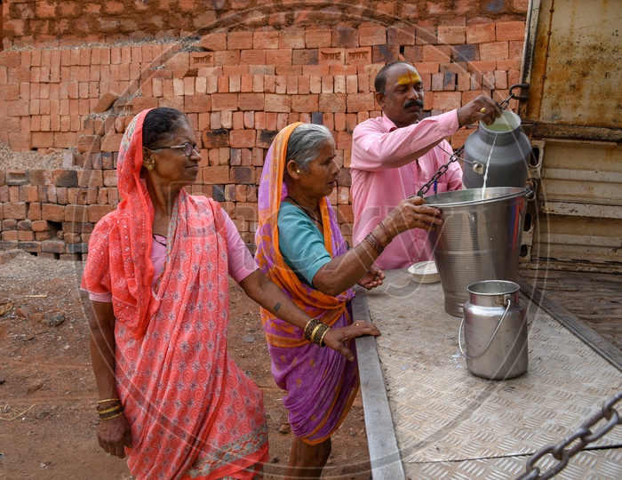 Local villagers selling milk to Dairy Farmers