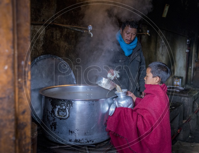 Giving tea to Buddhist Monk, Arunachal Pradesh