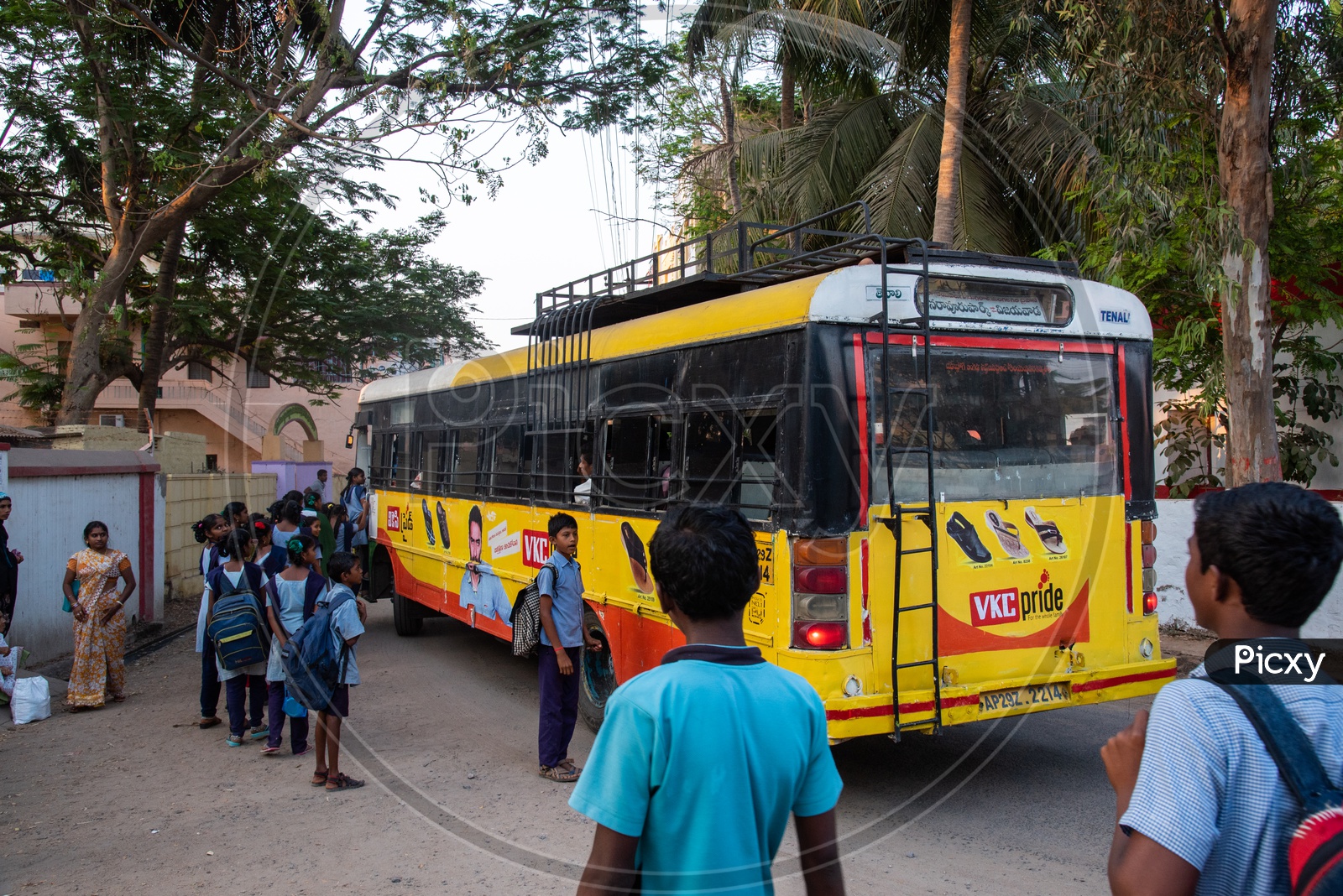 School Students boarding an APSRTC bus to reach their home at Duggirala Givt High School