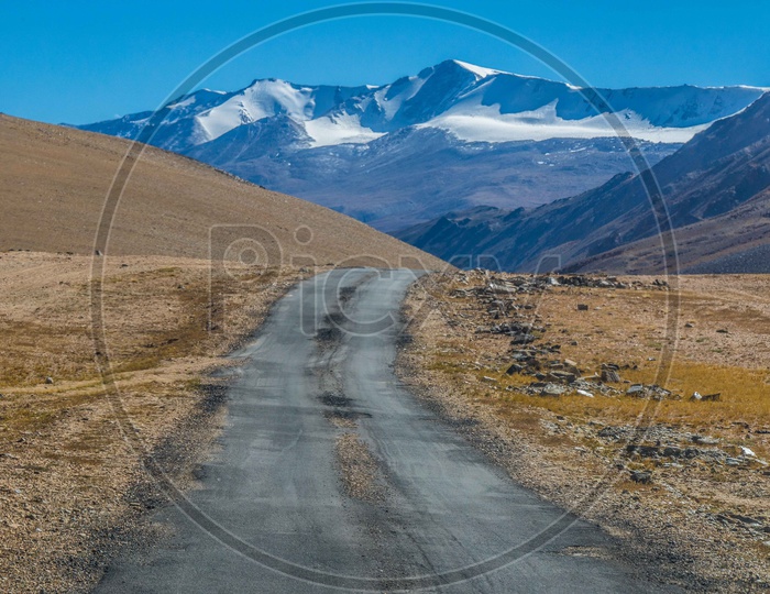 Roads in Leh_ladakh region amidst Hills and Snowy Mountains.