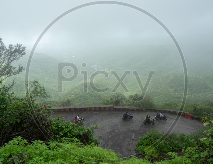 Bikers on way uphill to Sinhagad Fort