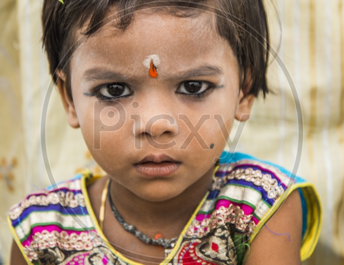 Child at Gudimalkapur Flower Market