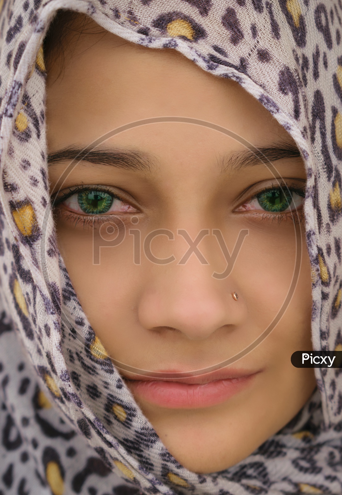 close up of  girl  wearing green contact lens