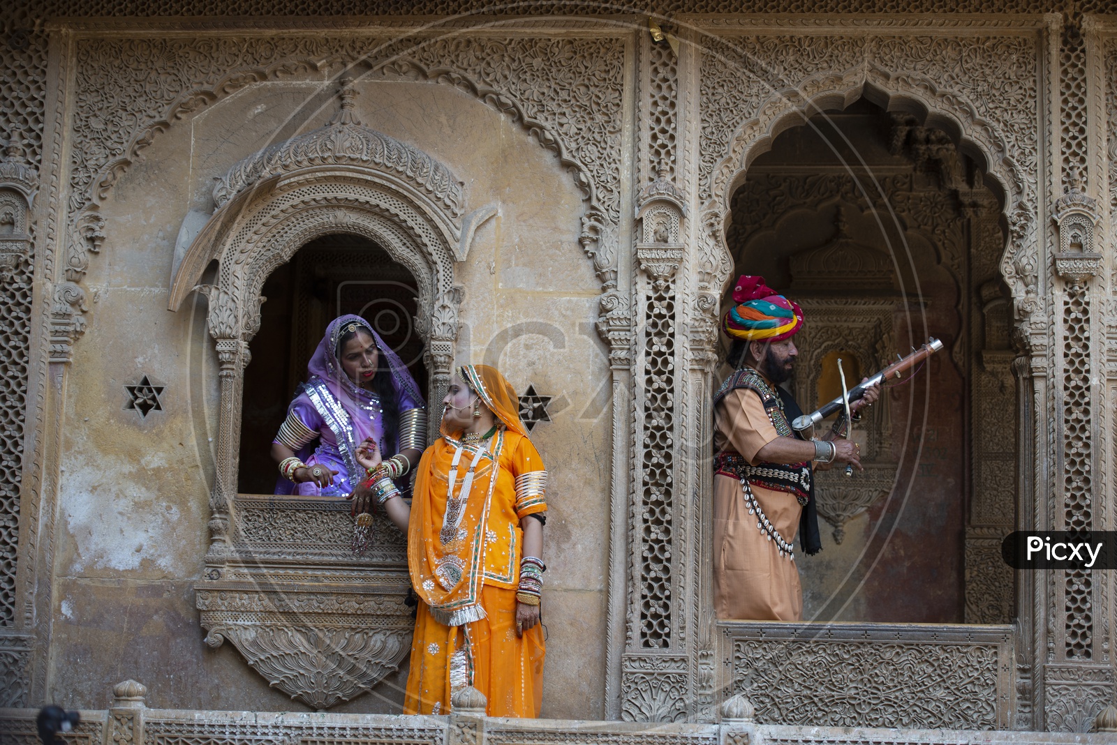 Rajasthani women and Man playing Music at Jaisalmer Fort