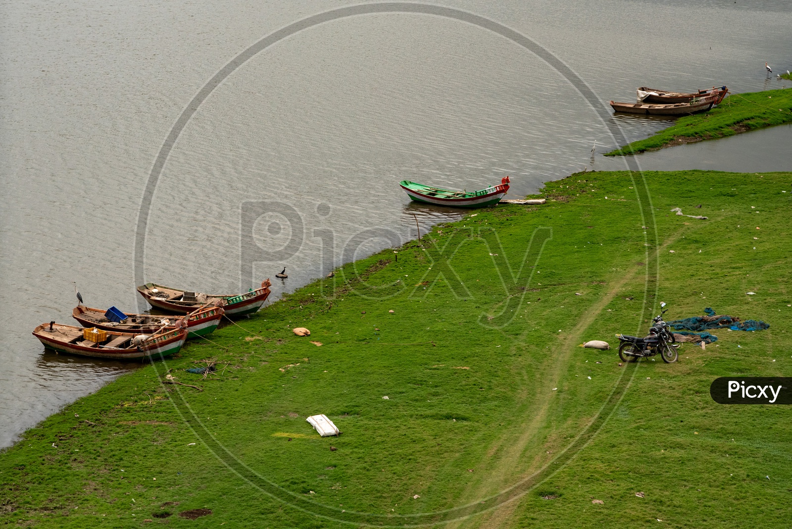 Boats parked at river banks near Bhigwan