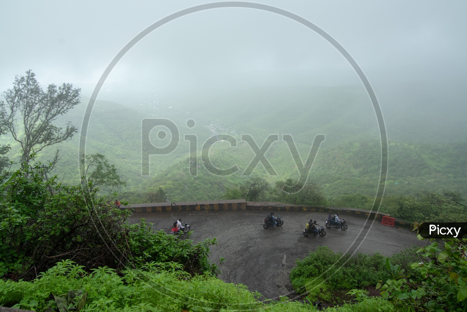 Bikers on way uphill to Sinhagad Fort