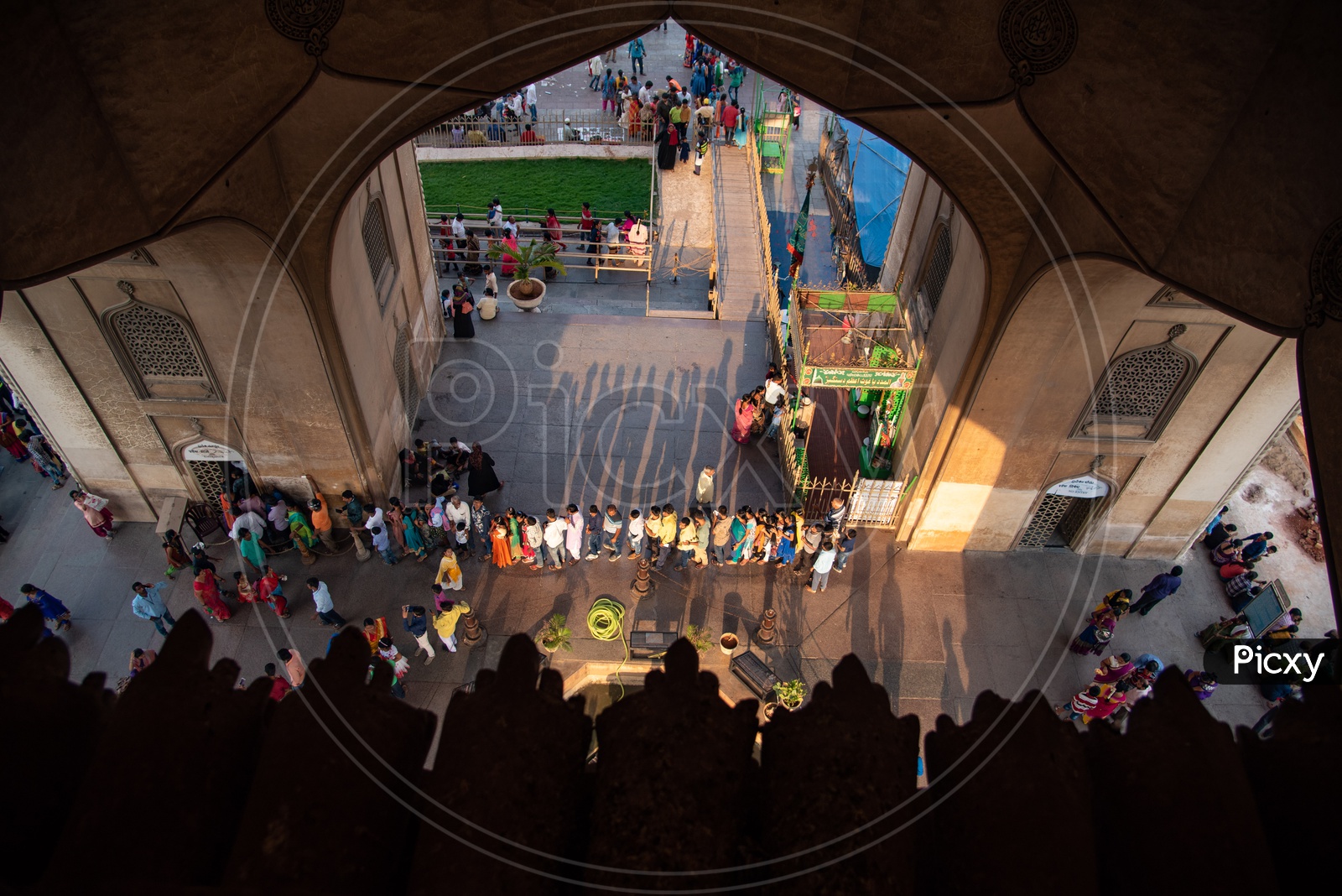 Toursits line up for tickets at Charminar