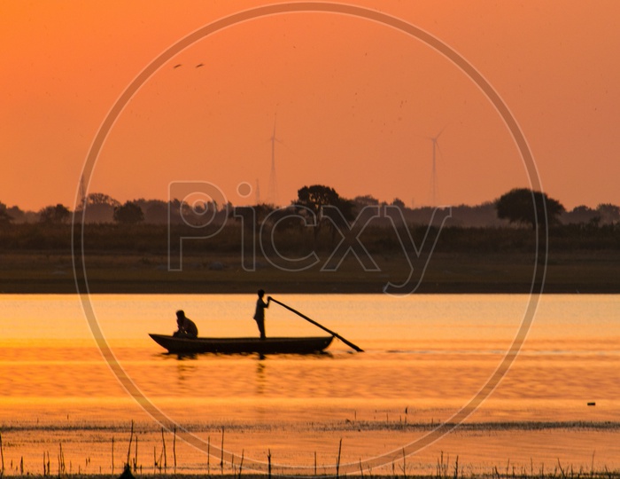 Silhouette of Fishermen at Sunset.