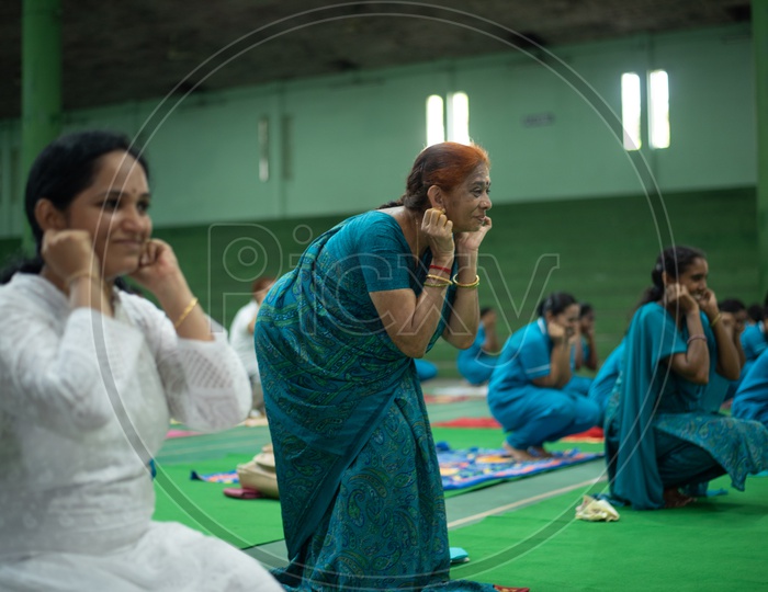 A senior/elder woman practising Yoga. International Yoga Day, 2018