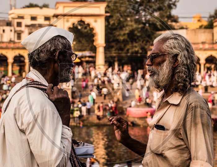 Two old man talking on streets