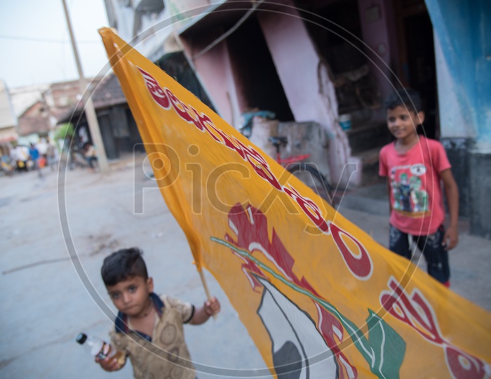 A kid with TDP Party Flag.