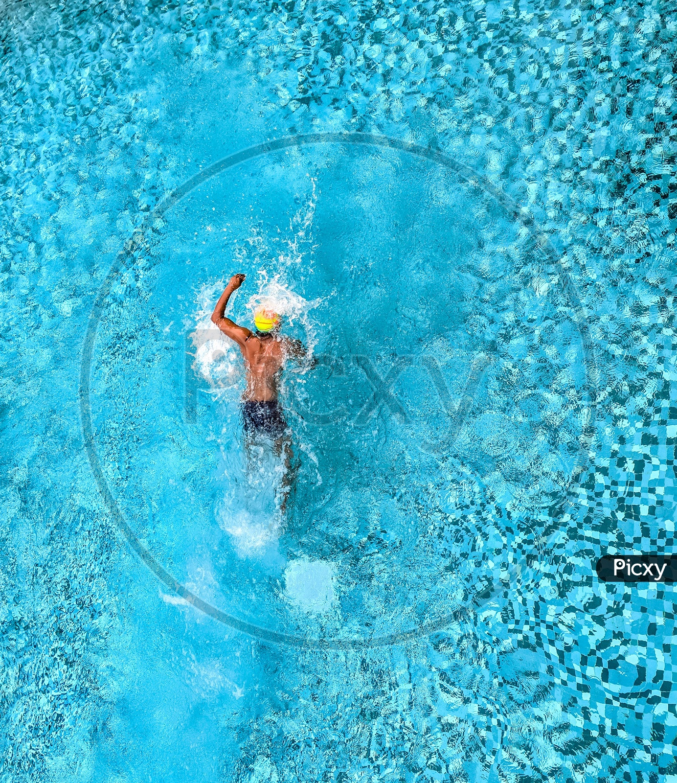 Man Swimming in a Pool