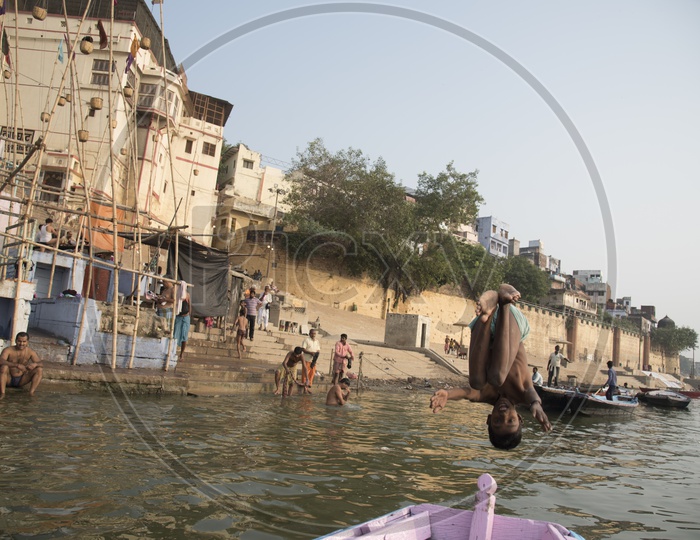 Kid Jumping into the River Ganga