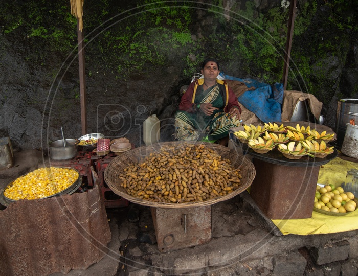 Lady selling delicious eateries at Sinhagad Fort