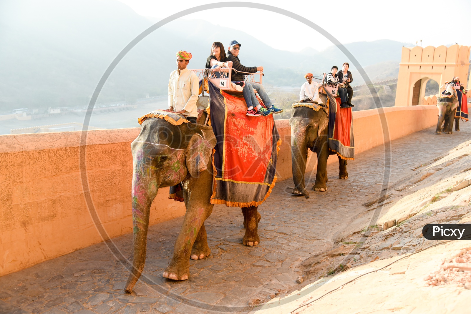 Tourists Enjoying ride atop Elephants