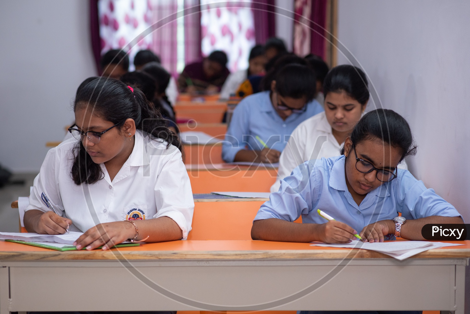 Students writing exams at an educational institute in India