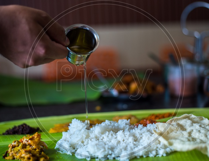 Ghee being poured in Andhra Meals.