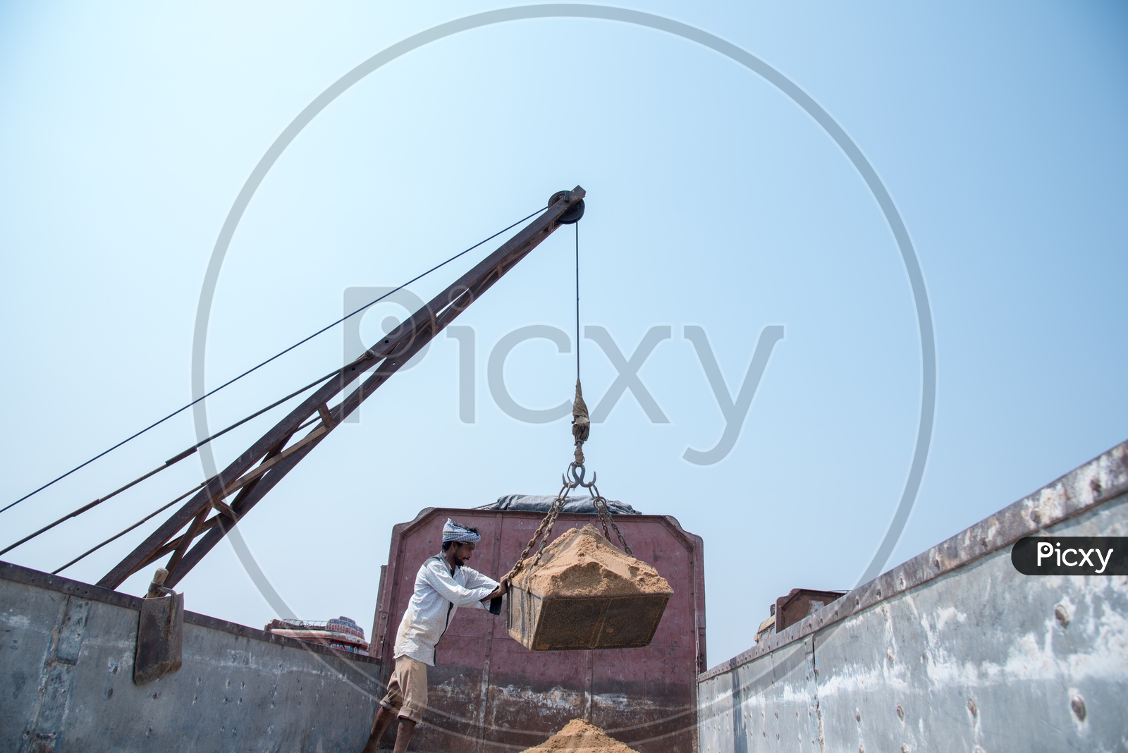 loading a lorry with sand at Rayapudi Sand Reach