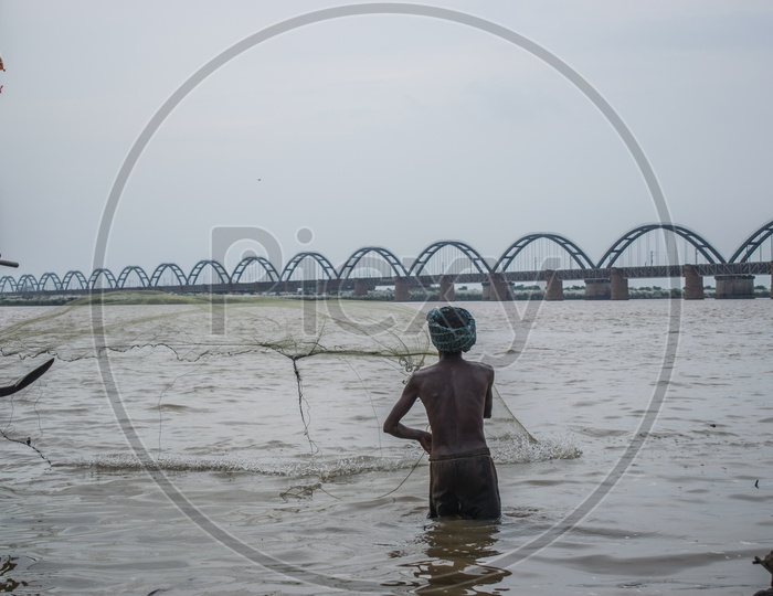 Fisherman tossing his net