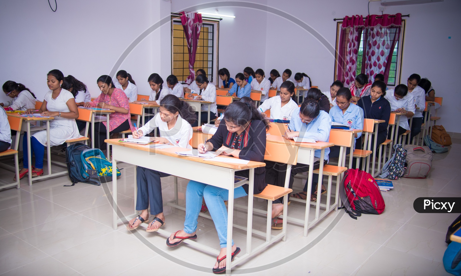 Students in an examination hall in at an educational institute in Telangana