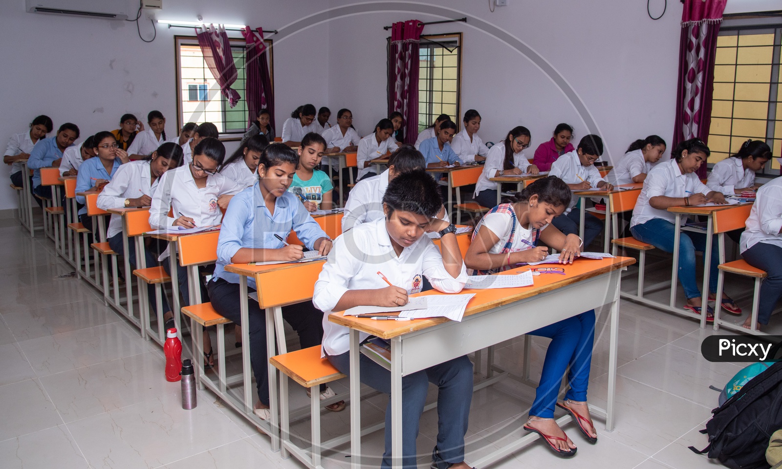Students in an examination hall in at an educational institute in Telangana