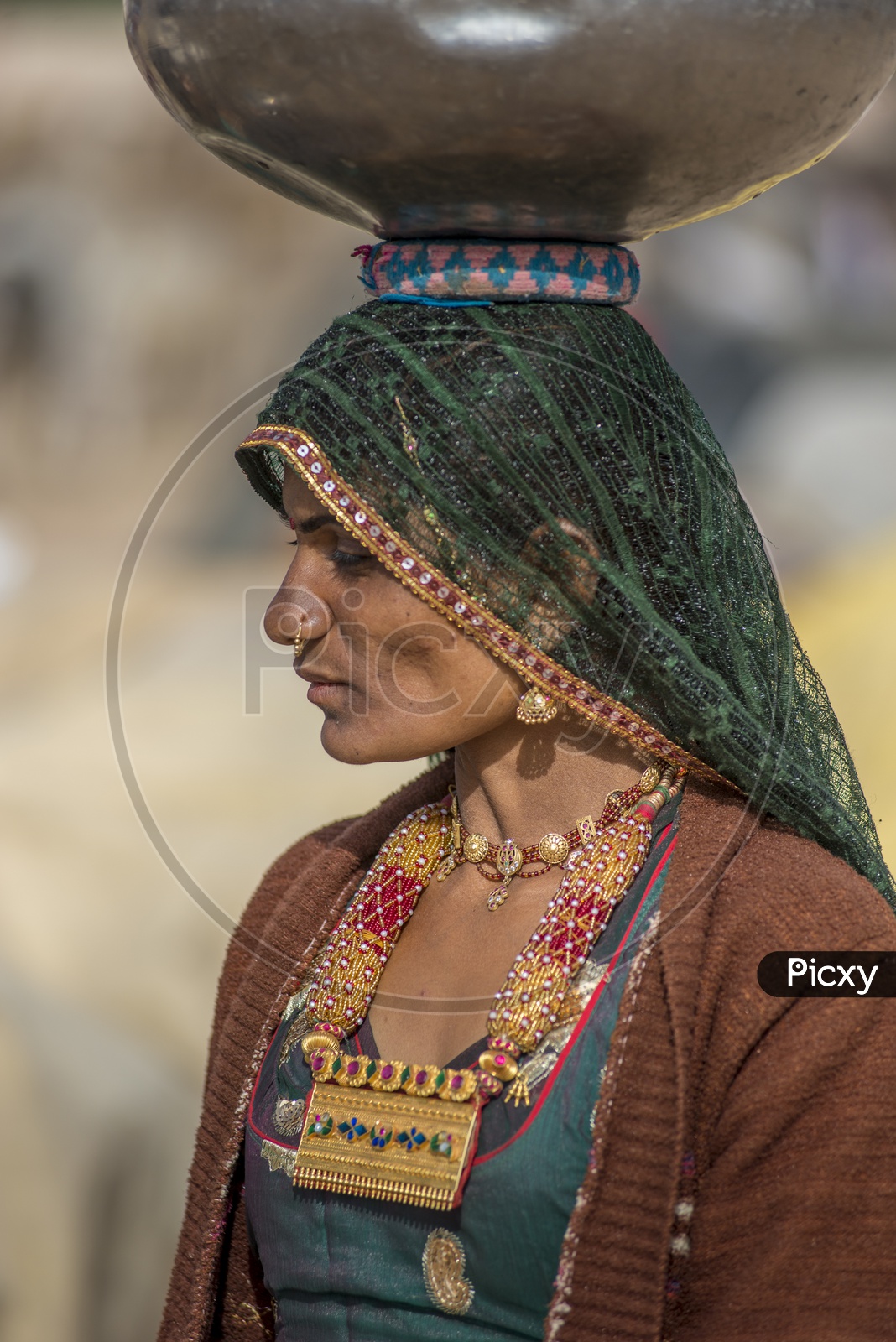 Rajasthani Woman Carrying water pot on her head