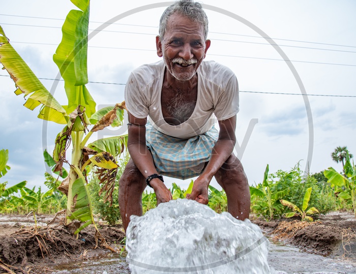 a happy farmer at a bore water pump.