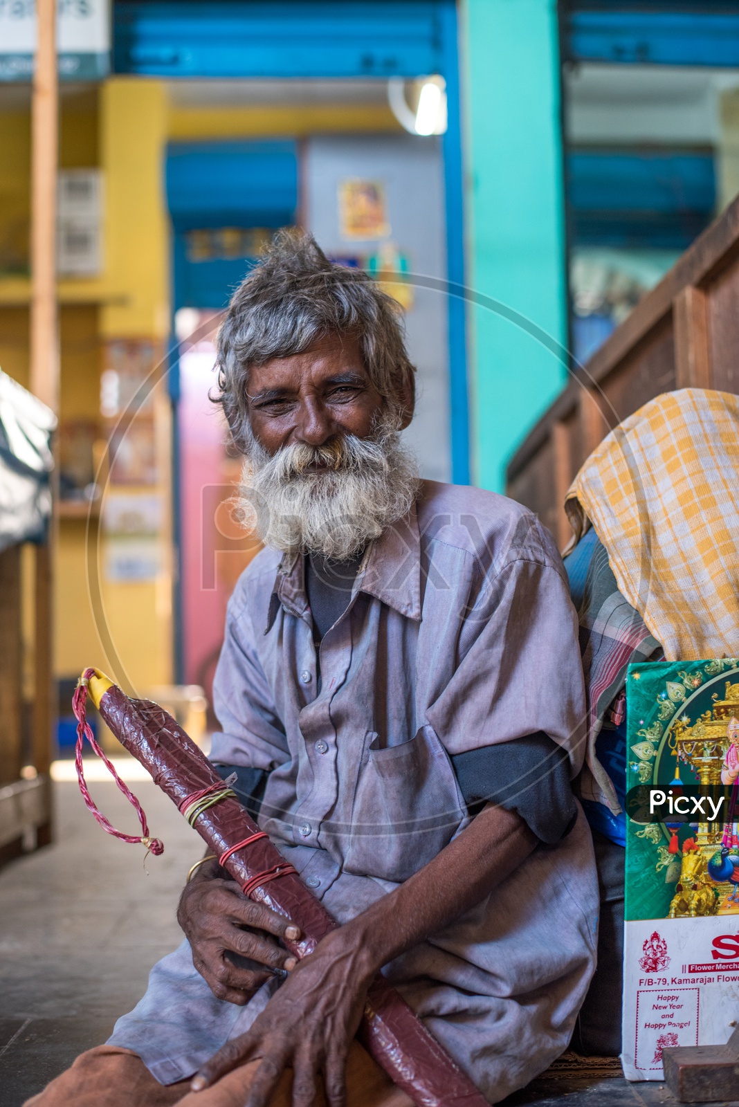 A portrait of an old Street Flower Vendor at Koyambedu Flower Market,Chennai