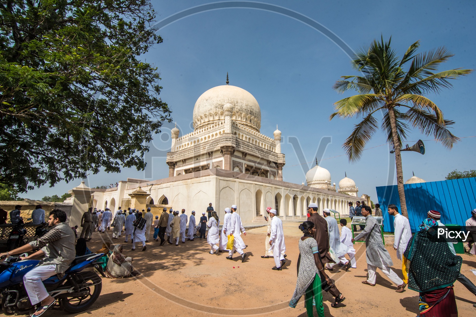 People heading for Ramadan Eid prayer meet at Qutb Shahi Tombs