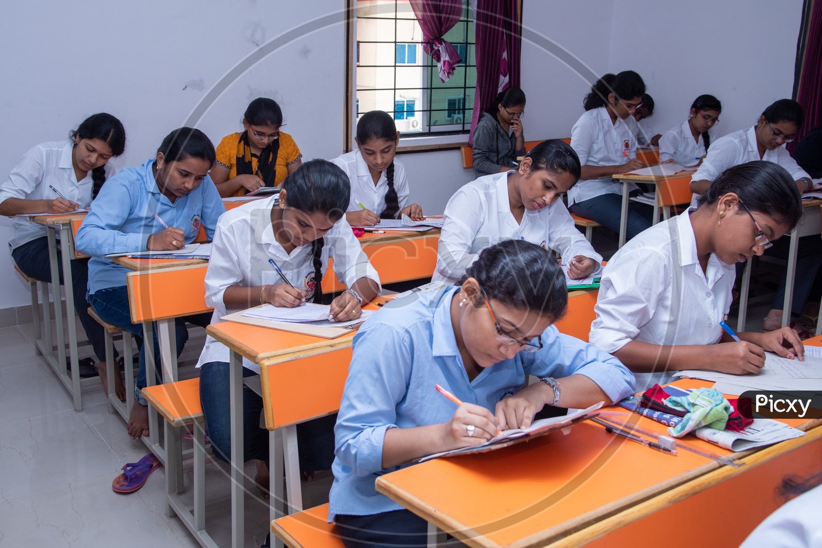 Image of Students write at an examination hall in an educational ...