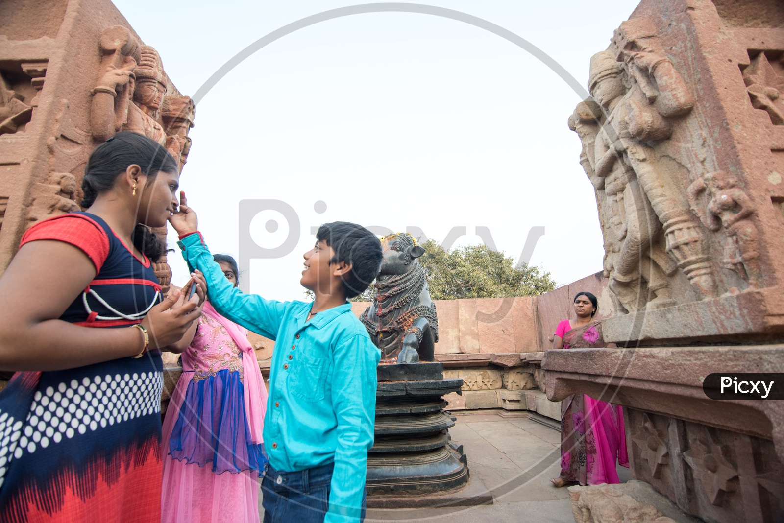 Devotees at Nandi Statue at Ramappa Temple