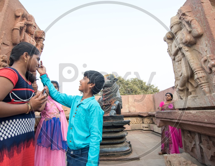 Devotees at Nandi Statue at Ramappa Temple