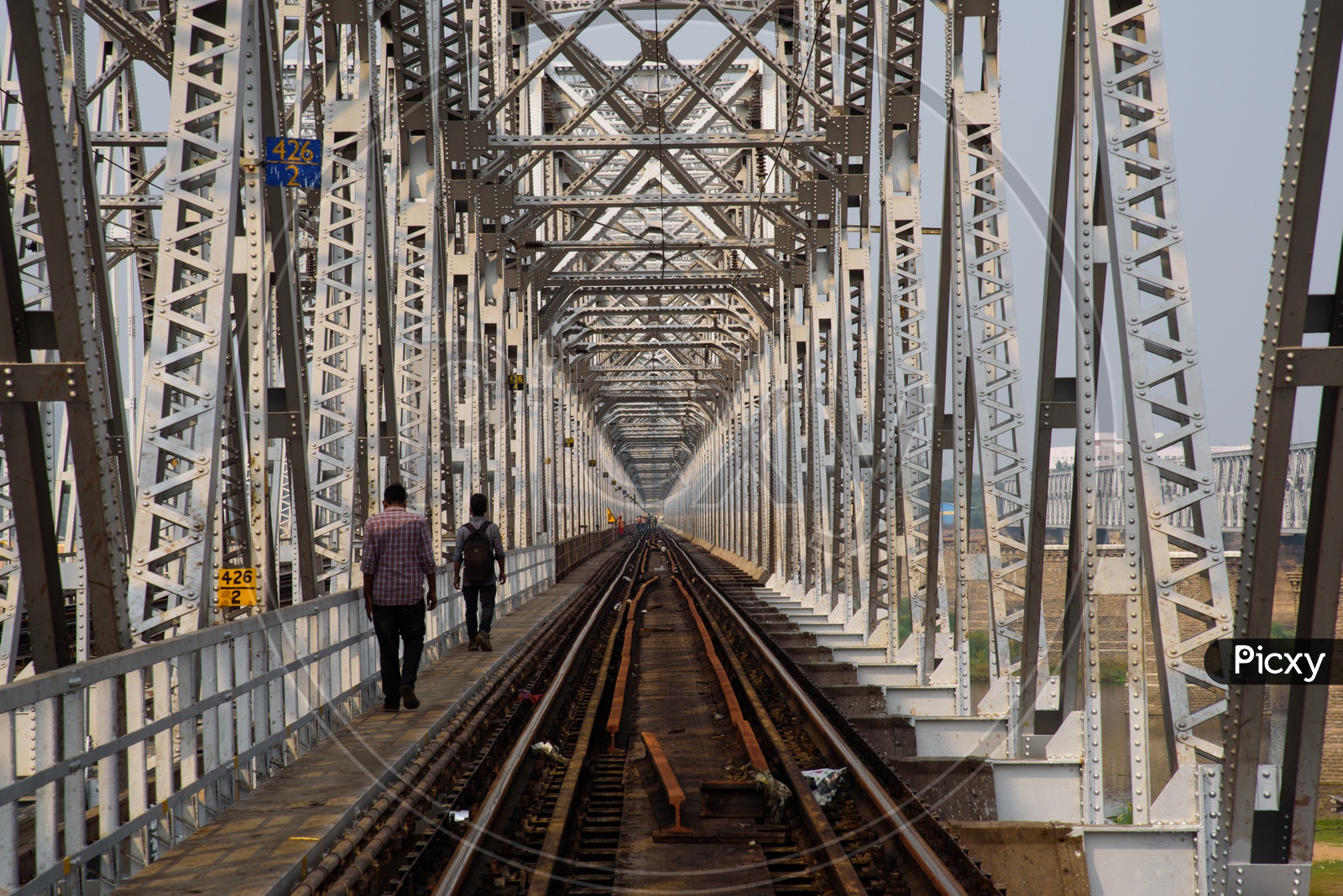 Commuters on Railway bridge.