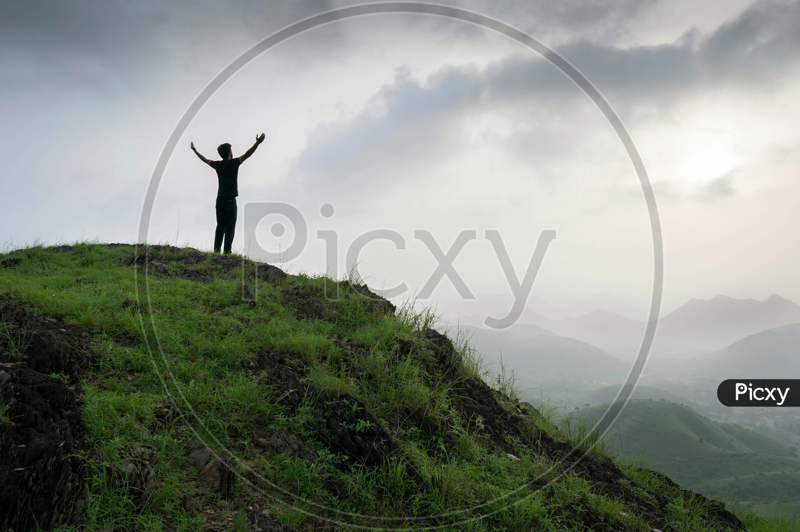 man standing of mountain top