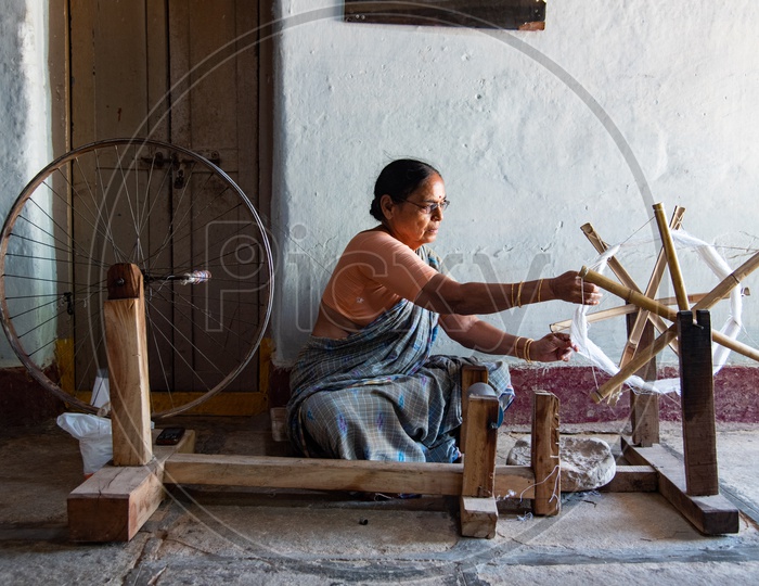 Lady working on a spinning wheel in Bhoodan Pochampally.