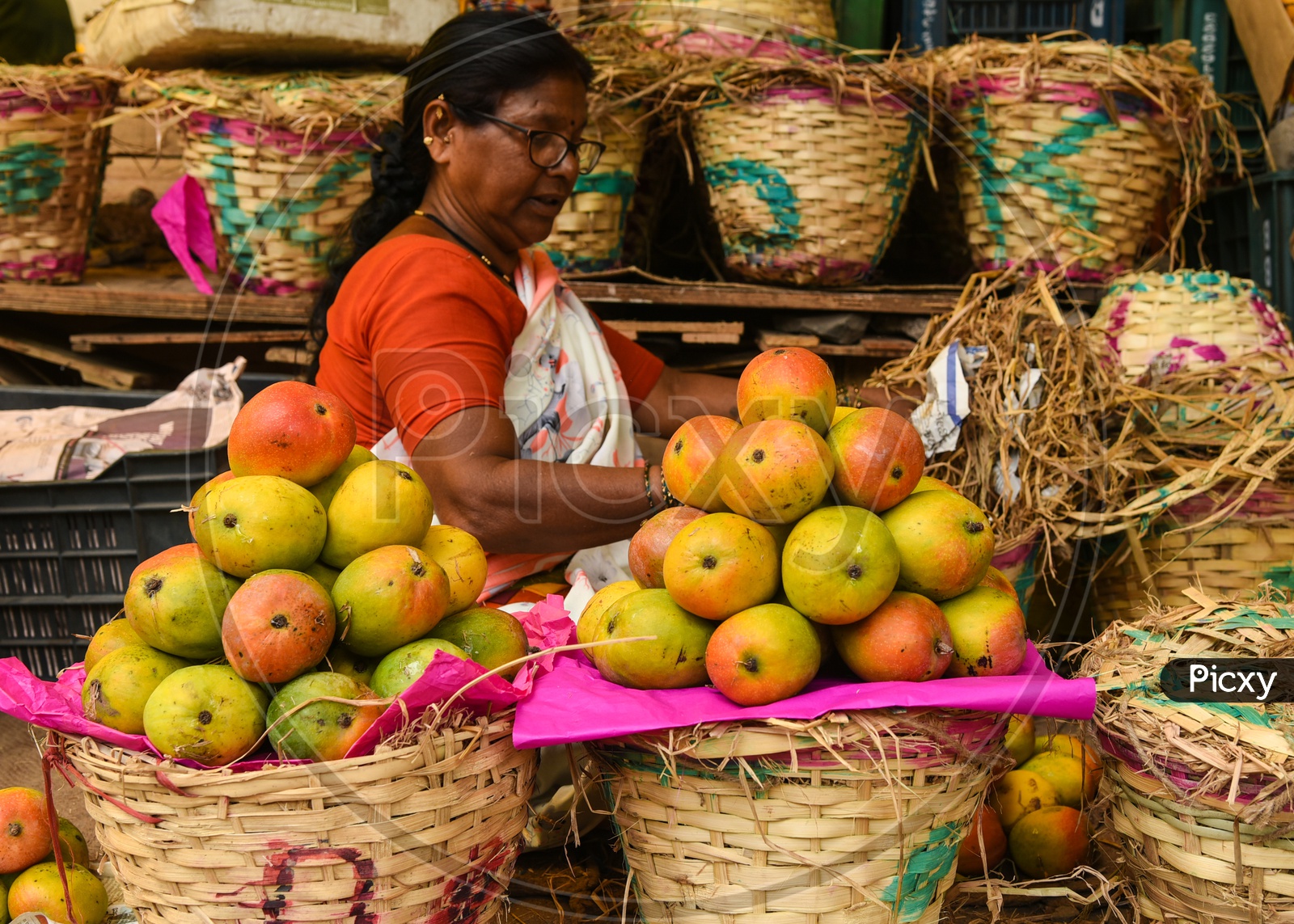 Woman selling Mangoes