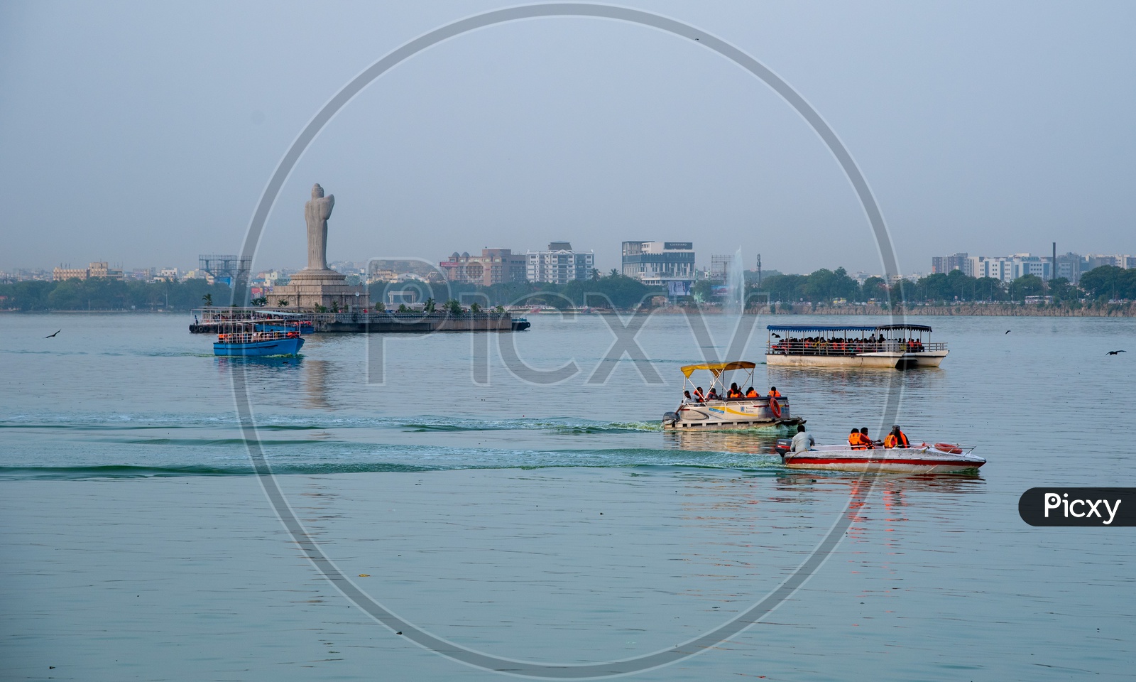 Tourists enjoying boat ride on Hussain Sagar on a Summer Evening