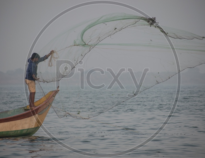 Young Fisherman Casting his Net