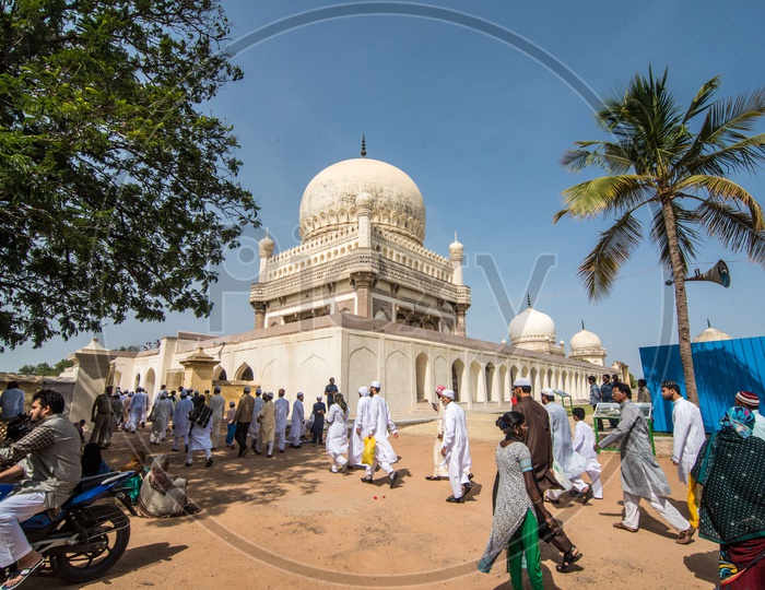 People heading for Ramadan Eid prayer meet at Qutb Shahi Tombs