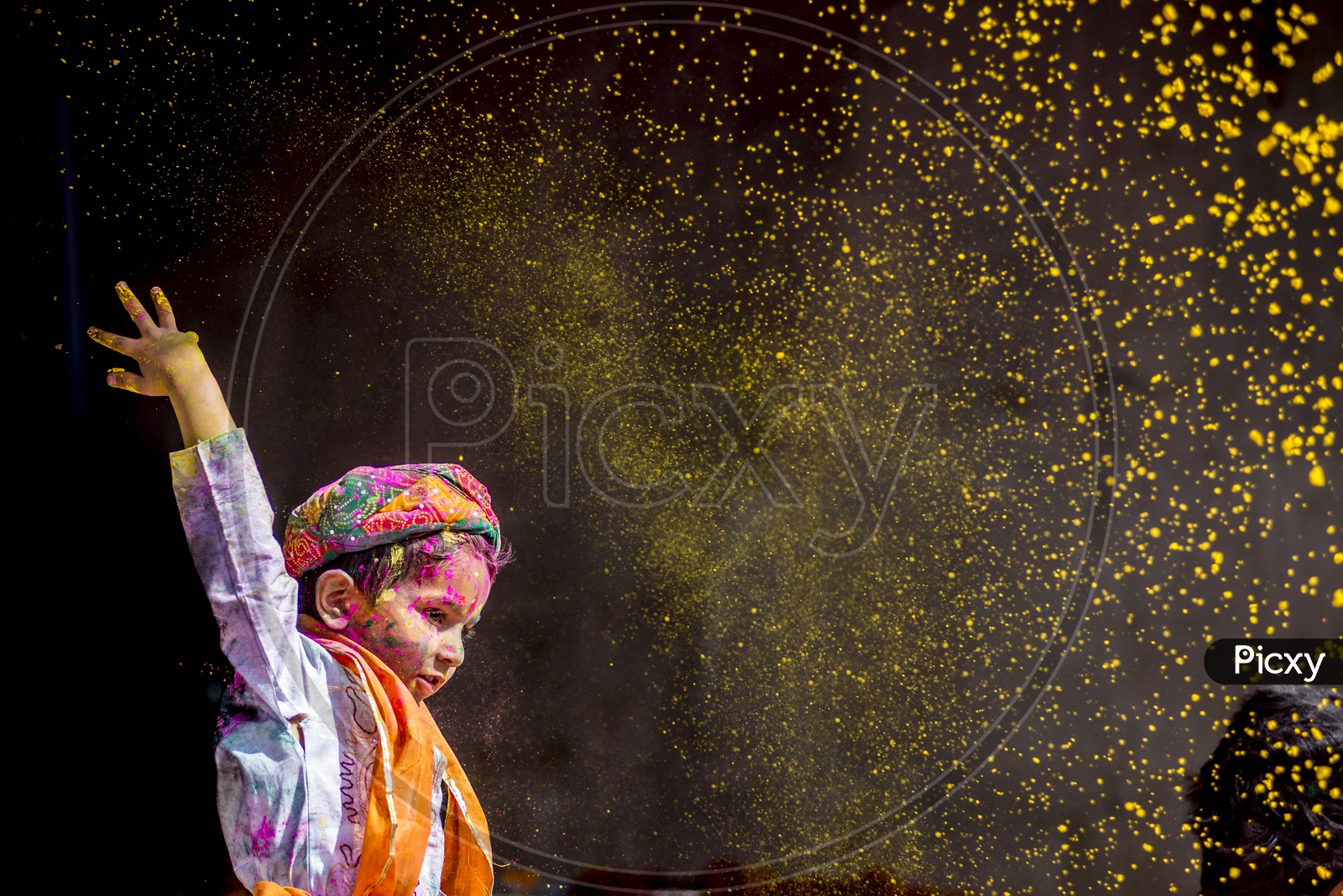 Child celebrating Holi Festival in Nandgaon, Brij Mathura