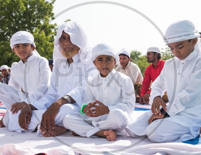 Family at Eid prayer meet at Qutb Shahi Tombs in Hyderabad