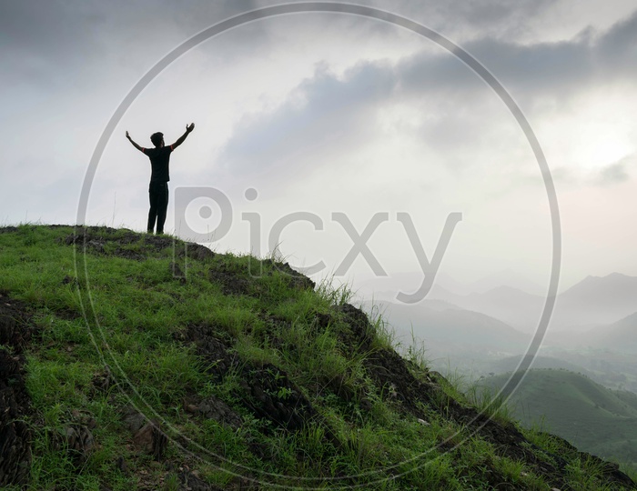 man standing of mountain top