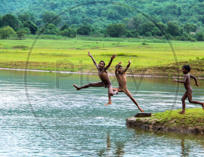Kids jumping in Lake