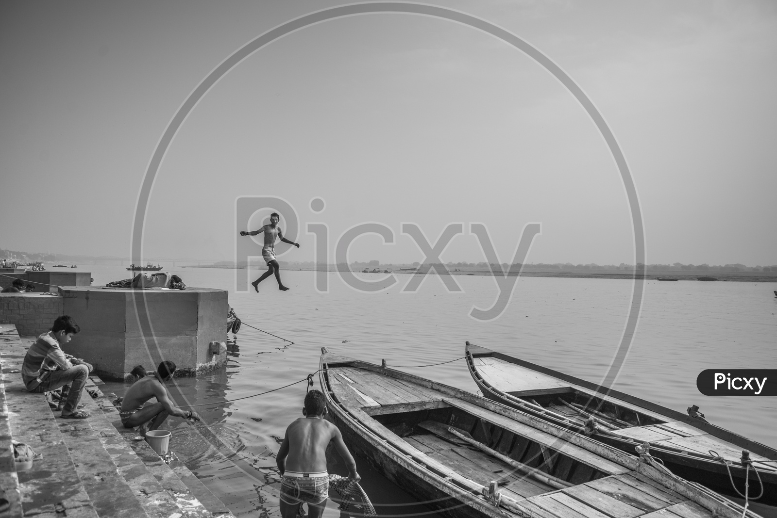Boy jumping into the Ganga River, Varanasi