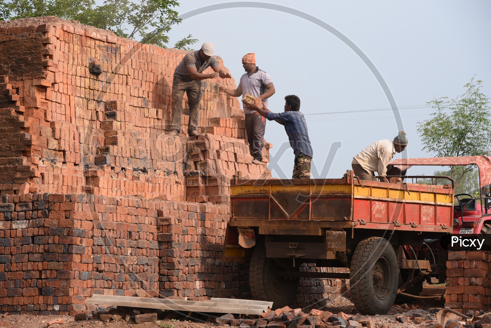 Loading Red Bricks on to Tractor